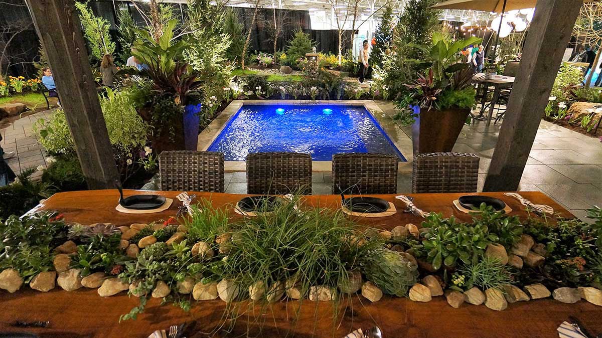 9' x 9' non-diving fiberglass wading pool with an 18-inch uniform depth, ideal for young children and backyard splash play.