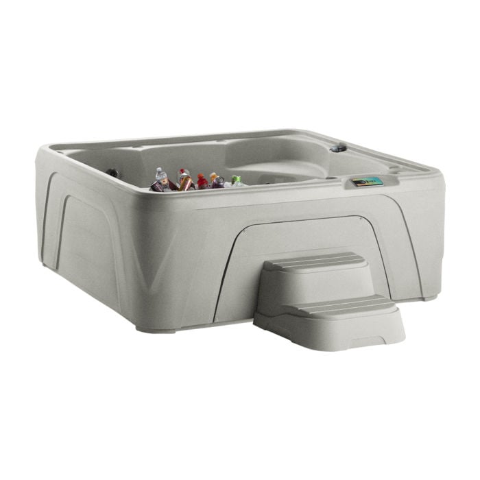 Studio shot of a Sand-colored Fantasy Spas Entice hot tub featuring a molded-in ice bucket filled with drinks, a digital control panel, and color-matched two-tier access steps.