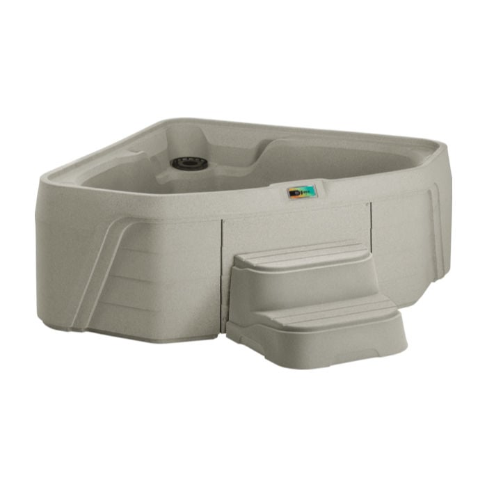 Studio shot of a Sand-colored Fantasy Spas Embrace triangular hot tub designed for corners, equipped with a digital control panel and matching two-tier access steps.