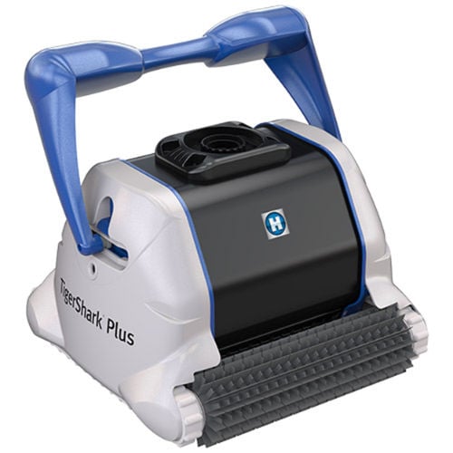 Studio product view of a white, black, and blue Hayward TigerShark series robotic pool cleaner featuring a top handle, side tracks, and front scrubbing brush.