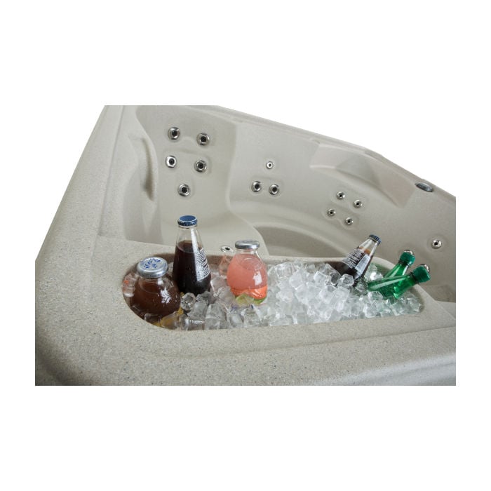 Close-up view of the Fantasy Spas Entice hot tub's built-in ice bucket filled with ice and chilled glass beverage bottles.