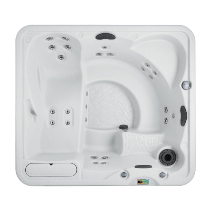 Direct top-down view of the white Fantasy Spas Entice Premier hot tub interior, displaying its deep lounge seat, open bench seating, molded-in ice bucket, and dark pillow accents.