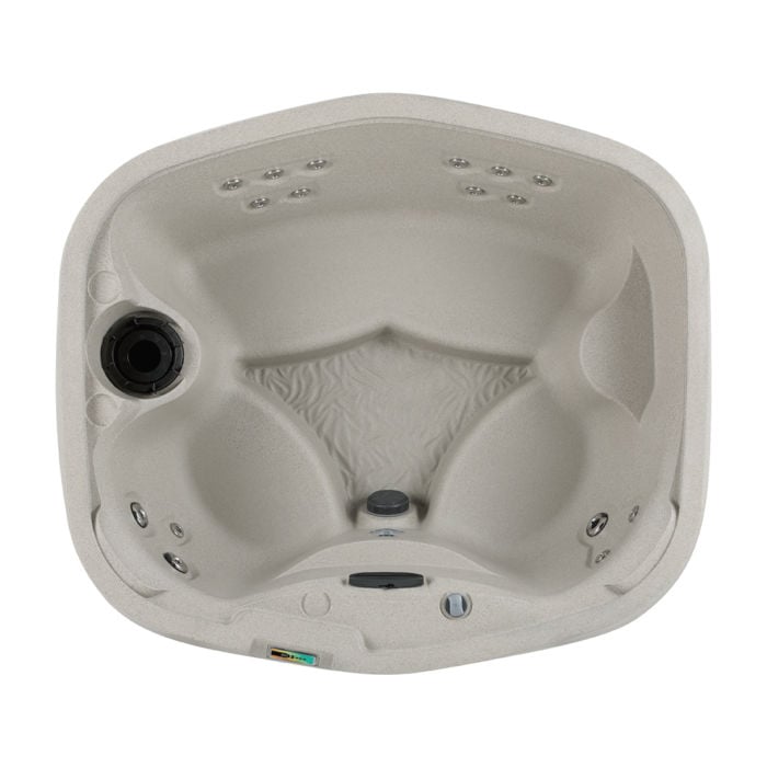 Direct overhead view of the Sand-colored Fantasy Spas Drift hot tub, showcasing its open barrier bench seating, 17 hydrotherapy jets, and interior layout.