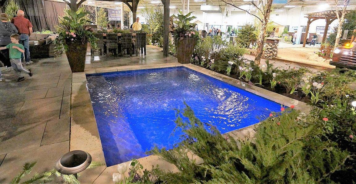 13.5' x 11.5' non-diving fiberglass wading pool with an 18-inch uniform depth, offering a spacious area for family fun and relaxation.